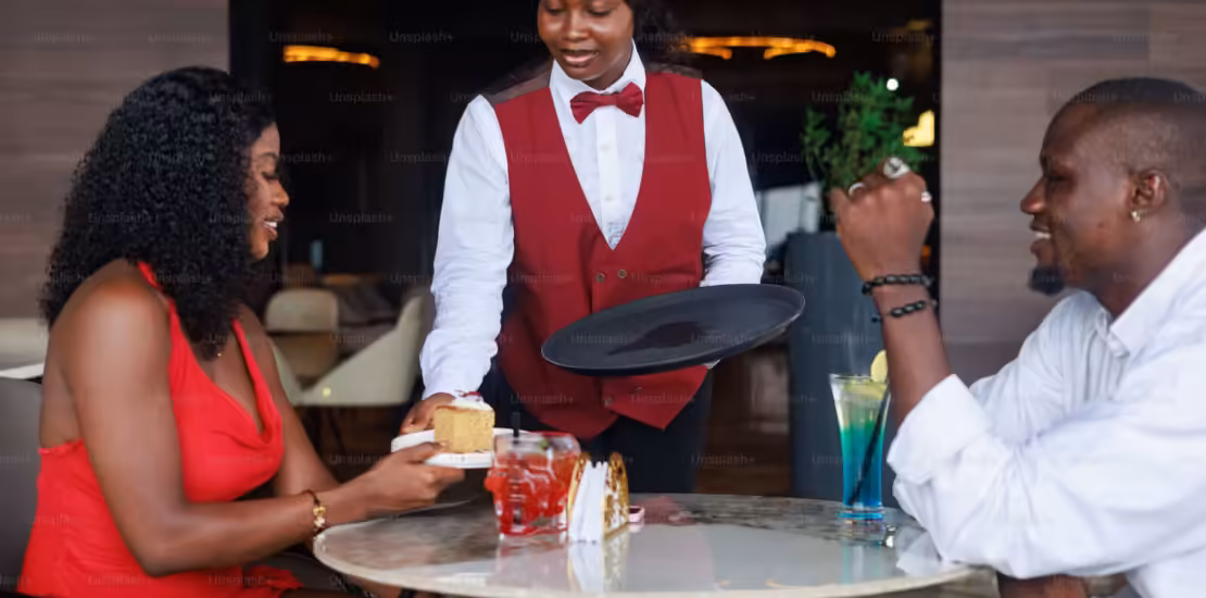 waiter serving food simbapos kenya
